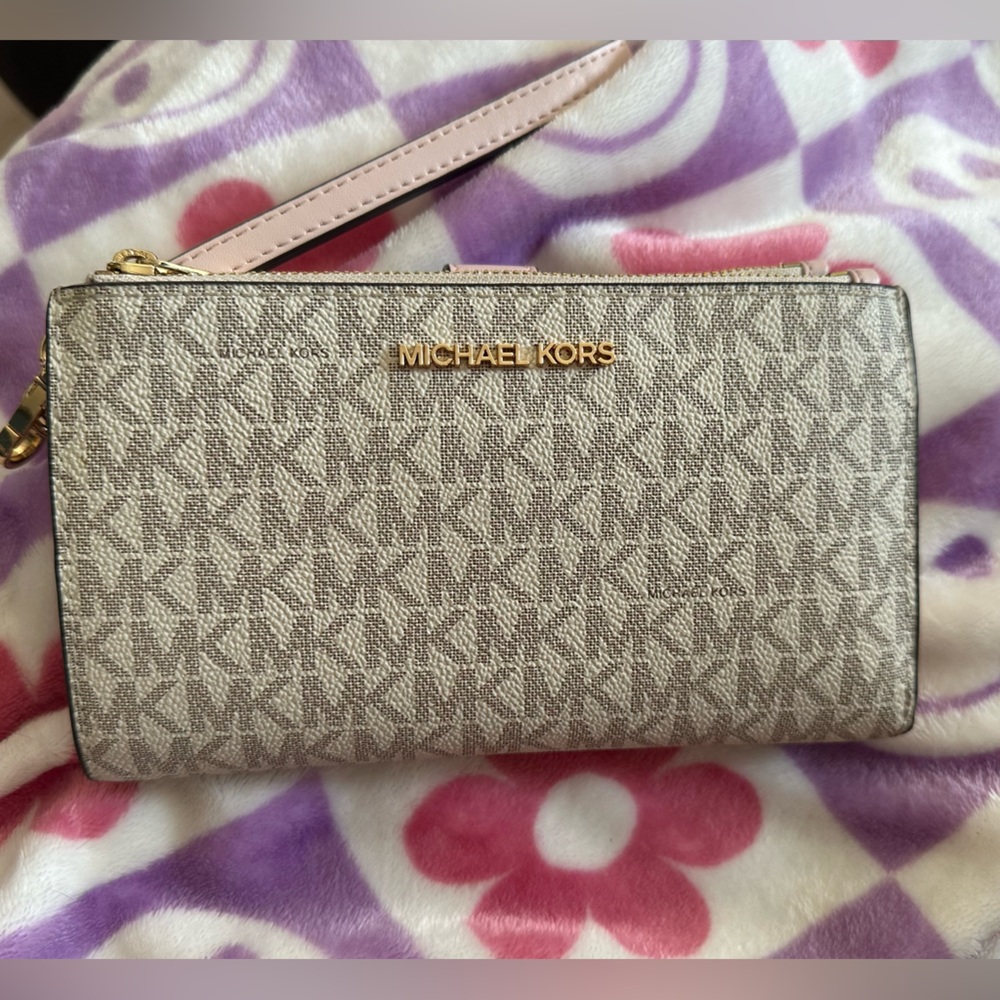 Authentic LIKE NEW MK smartphone wristlet wallet.